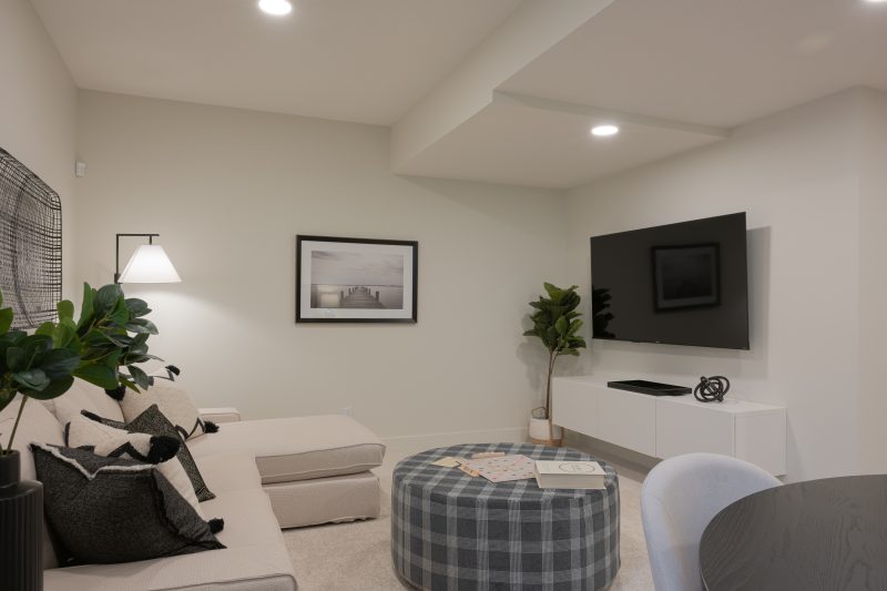 Developed Basement living room in Anthem's front drive 120 showhome in Kinglet by Big Lake