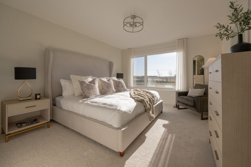 Primary bedroom in Anthem's front drive 120 showhome in Kinglet by Big Lake